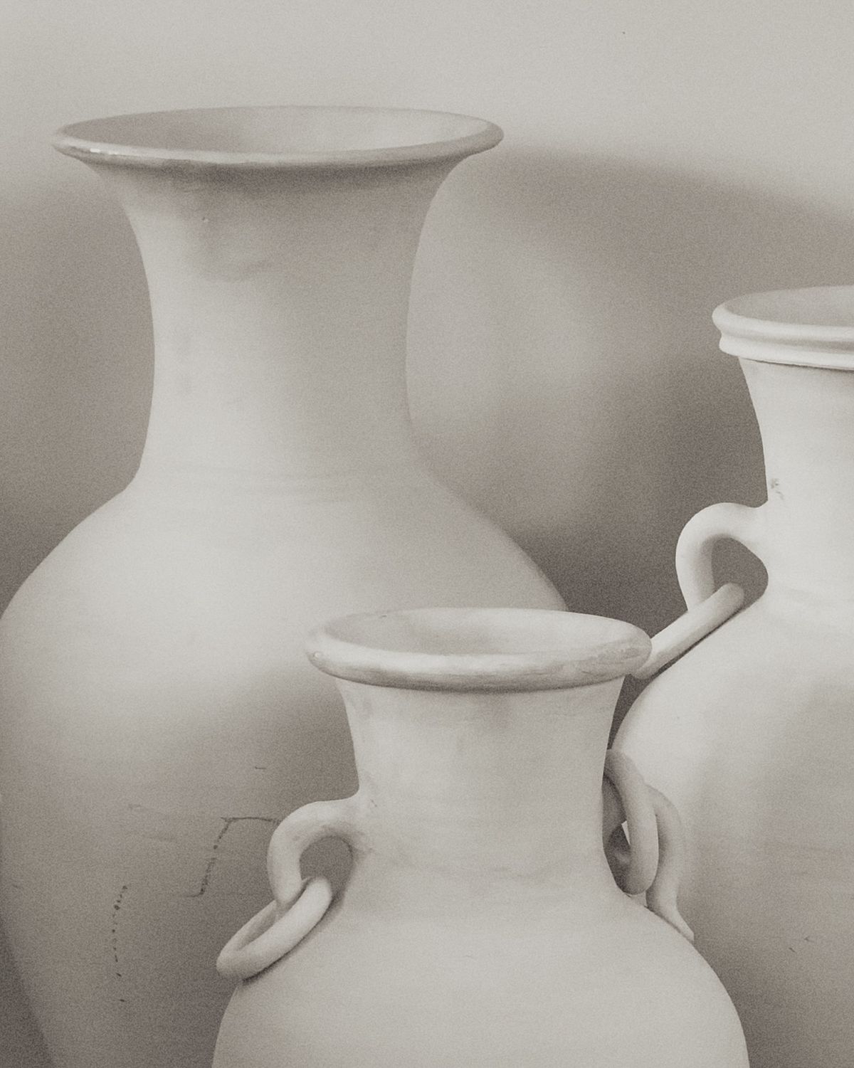White ceramic vases in soft light